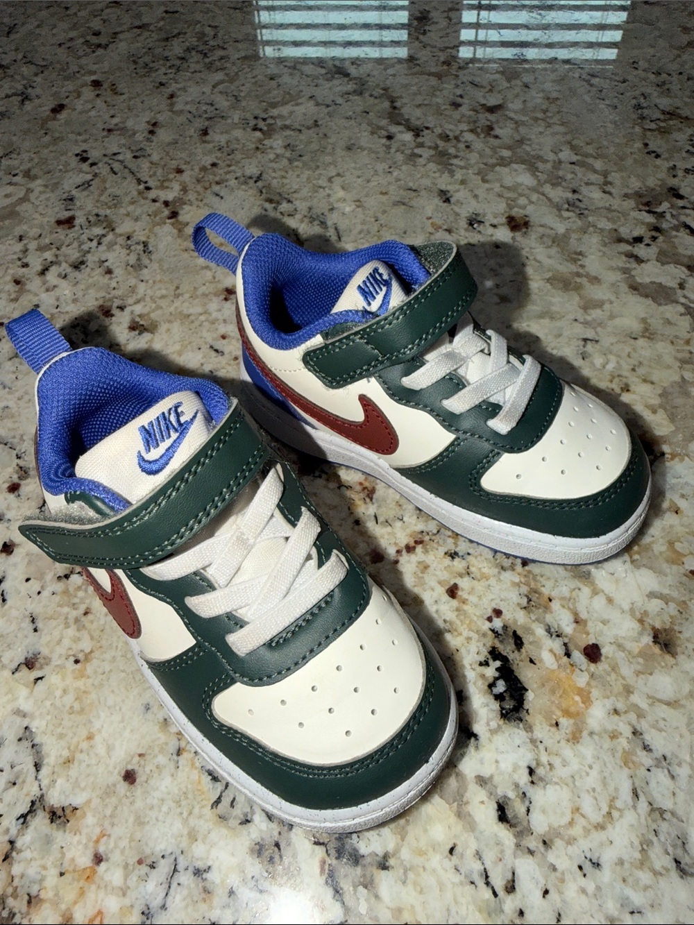 Nike Kids White and Dark Green Low-Top Sneakers with Blue Accents